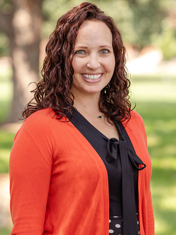 A woman poses for a professional headshot.