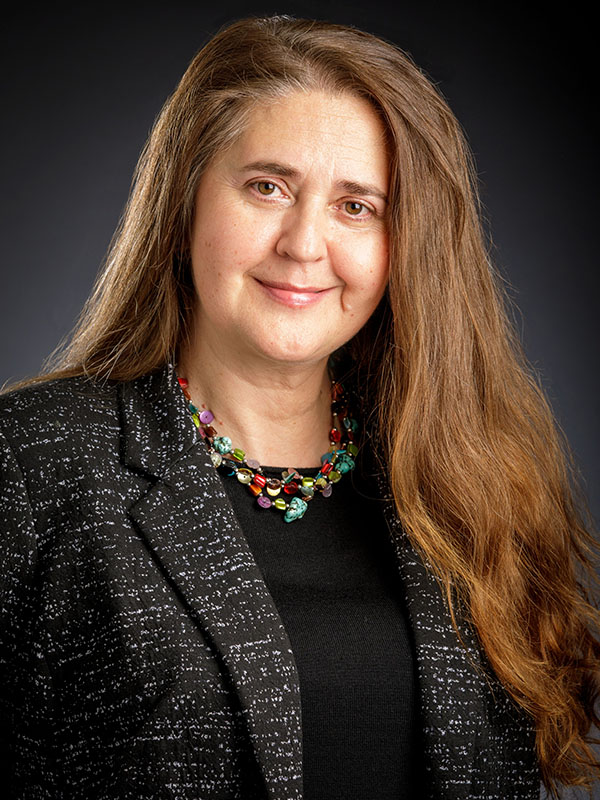 A woman poses for a professional headshot.