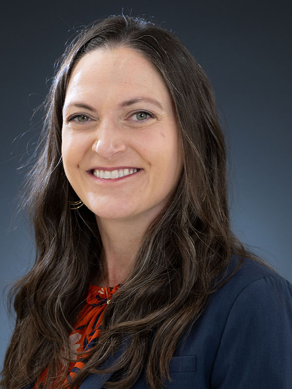 A woman poses for a professional headshot.