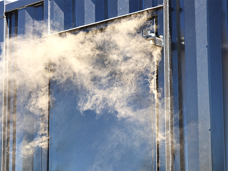 Smoke is seeping out of the door of the fire simulator
