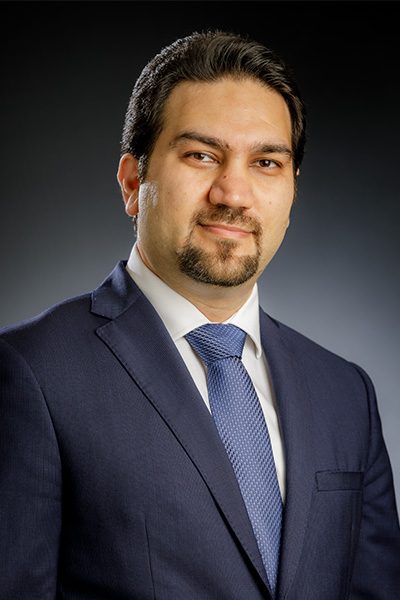 Dr. Hamid Pouya is shown wearing a suit in a faculty portrait for Oklahoma State University.
