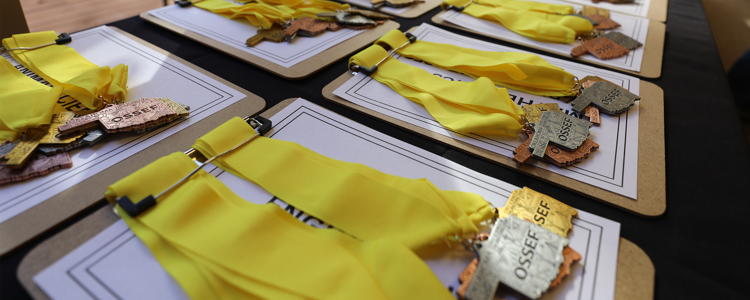 OSSEF awards table with medals