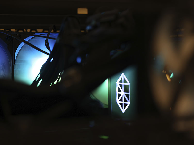 Electronic testing equipment and illuminated display screens are shown in a laboratory used for transportation research and data collection.