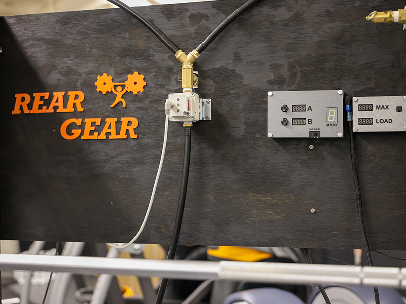 Signage on REARGEAR 2.0, an innovative weightlifting concept that uses gas-powered resistance instead of free weights.