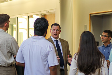 Andrew W. Ballenger speaks with Oklahoma State University students following a discussion on Africa’s growing role in global affairs, providing opportunities for students to engage directly with an expert on international relations and