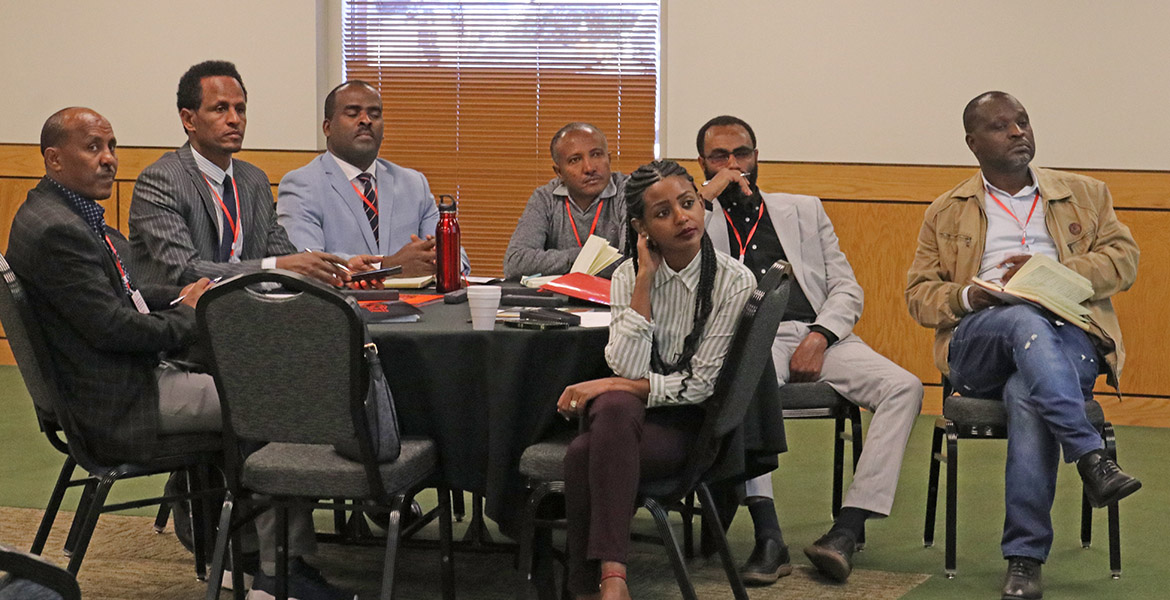 Higher education delegates from Ethiopia gathered around a table for an information session hosted by OSU Global.