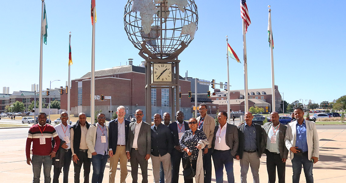 Group photo of delegates outside of the Wes Watkins Center