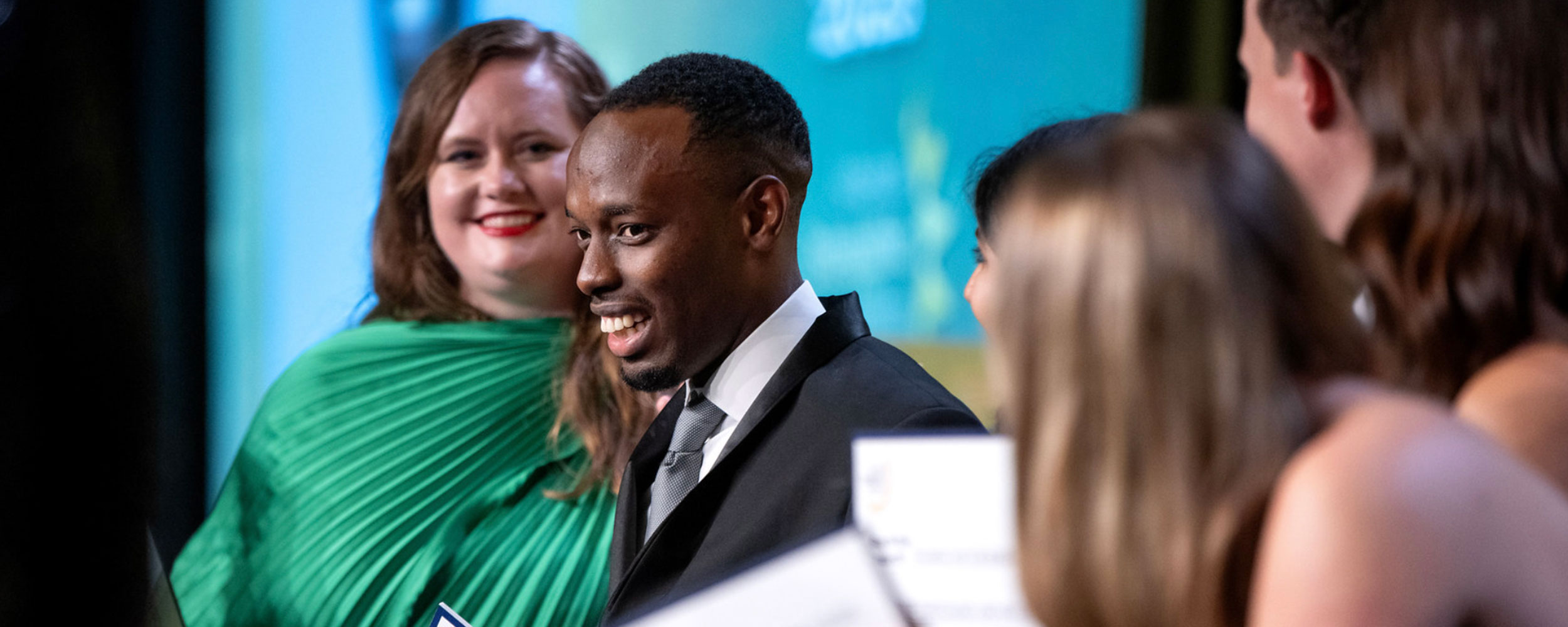 Medical student Eddy Bagaruka accepts a scholarship from the American Osteopathic Foundation.