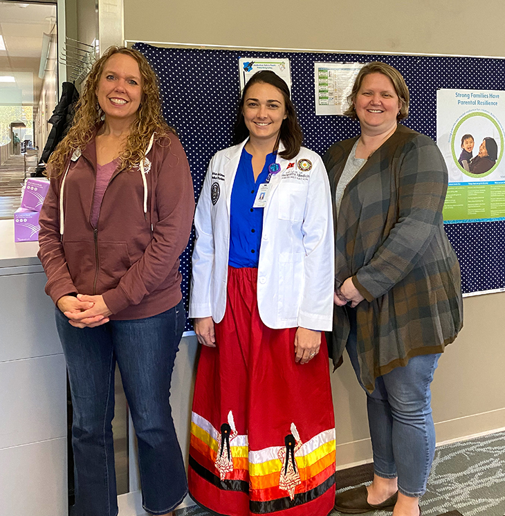Ashton Glover Gatewood, center, at the Benteh Nuutah Valley Native Primary Care Center in Wasilla, Alaska.
