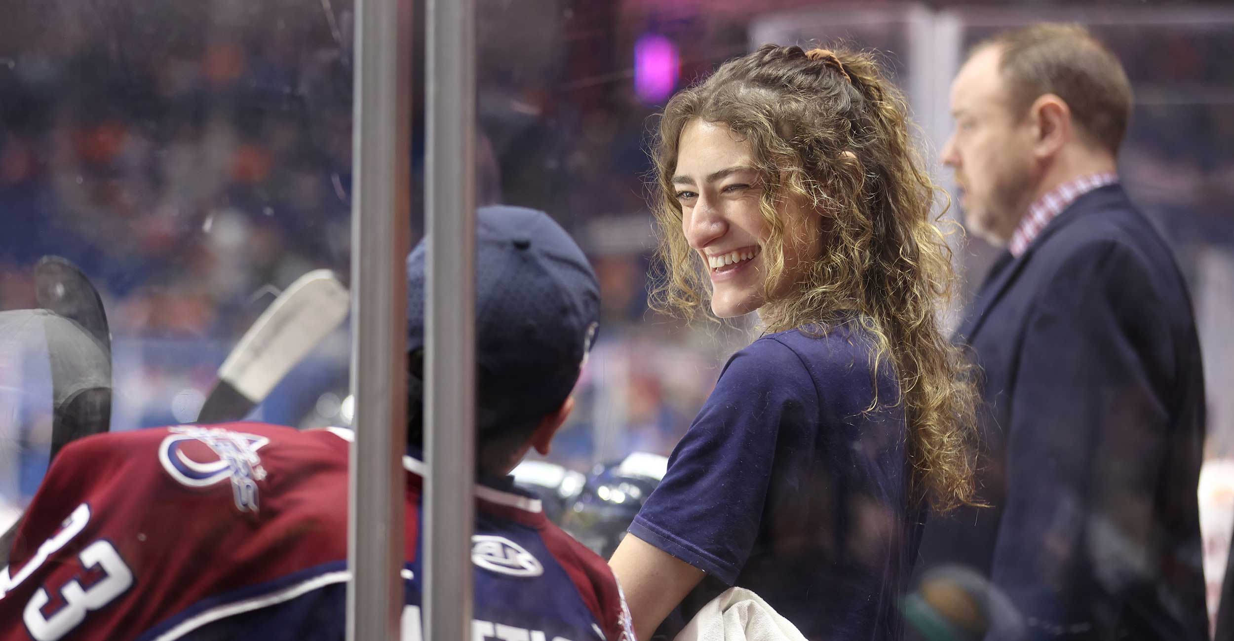 Tulsa Oilers hockey athletic trainer Sara Latos laughs with a hockey player during a Tulsa Oilers hockey game at the BOK Center in Tulsa.