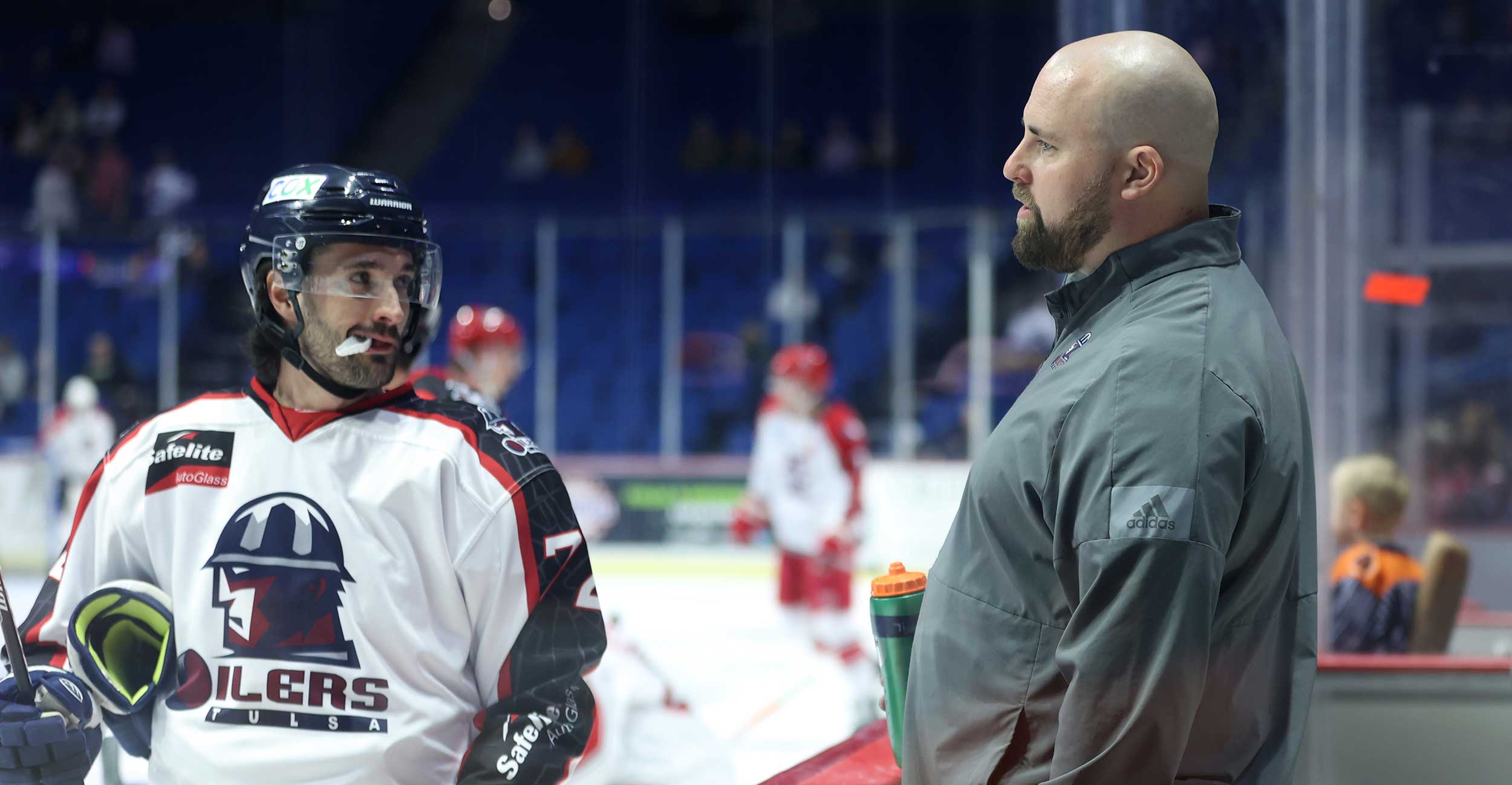 Steve Lintern, director of health and performance for the Tulsa Oilers and clinical athletic trainer at OSU-CHS' Athletic Training program, talks with Tulsa Oilers hockey player Darren McCormick before a game in Tulsa on March 11, 2022.