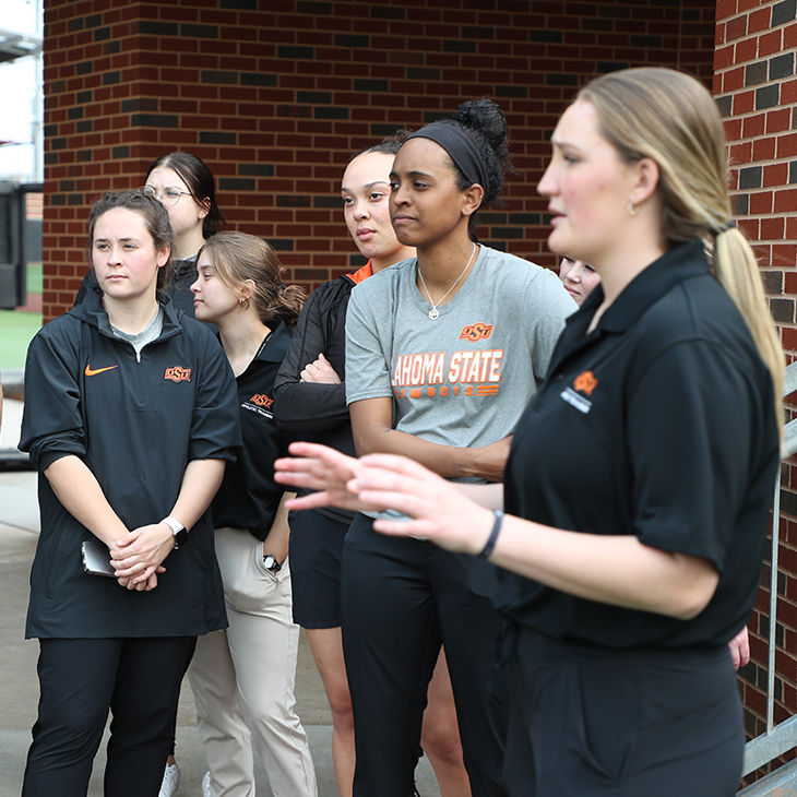 Kaleigh Hanzlick, OSU-CHS Athletic Training second-year student, leads a tour of OSU baseball's O'Brate Stadium for first-year Athletic Training students.