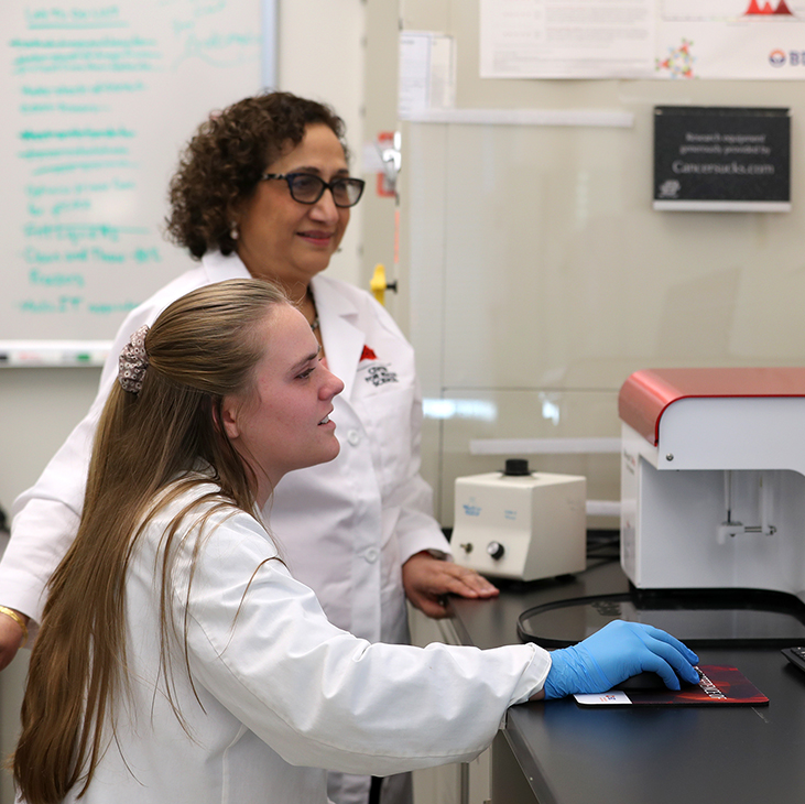 Dr. Rashmi Kaul and Biomedical Sciences student Logan Swope.