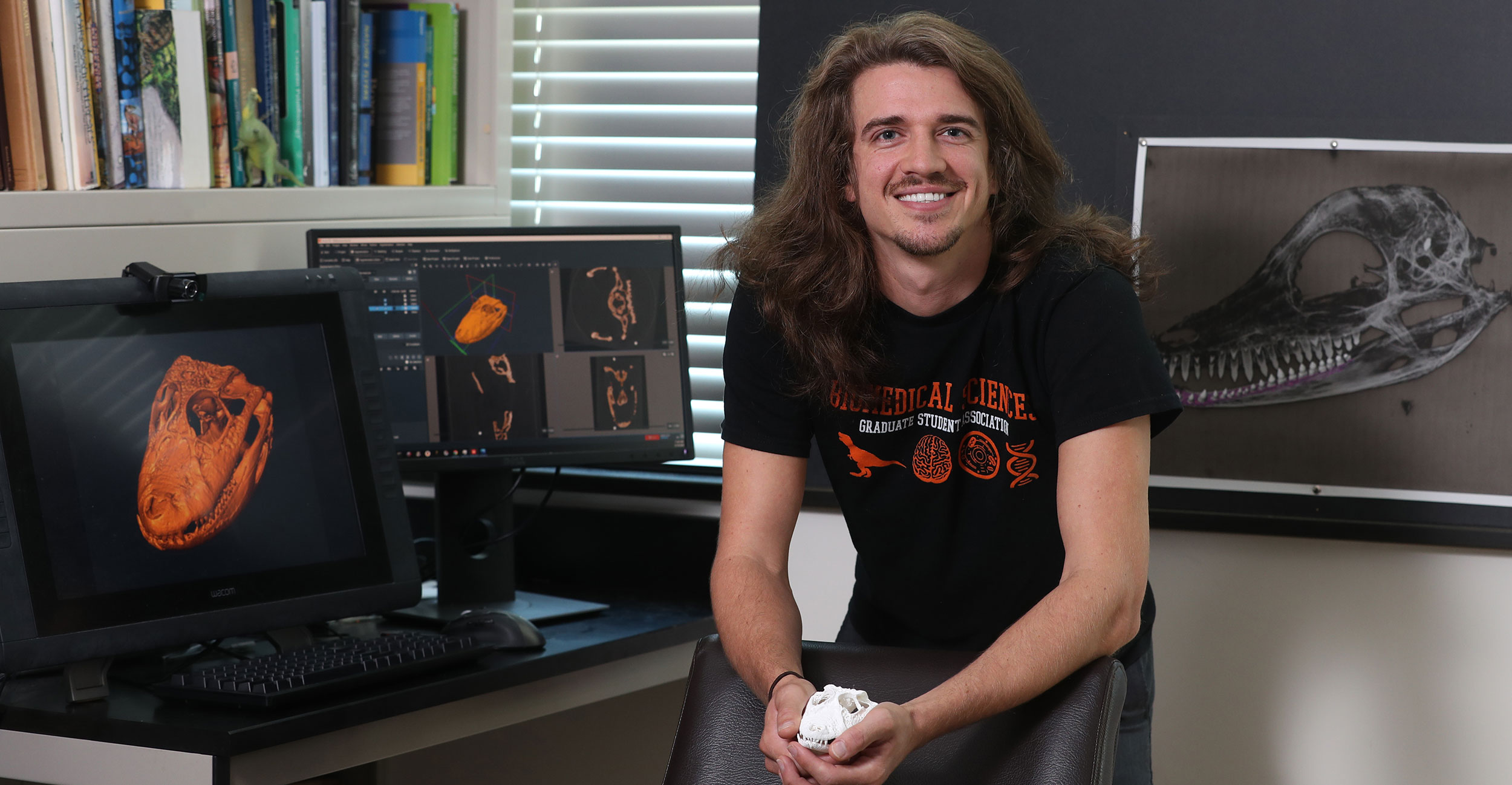 Forrest LaFleur, a master’s candidate in Human Anatomy and Vertebrate Paleontology, holds a model of the skull of an ancient crocodylia in one of the labs at the OSU Center for Health Sciences in Tulsa.