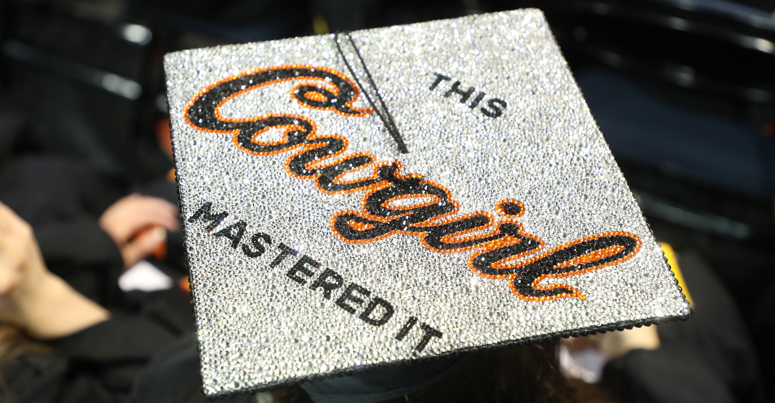 The top of a mortar board is decorated with the words This Cowgirl Has Mastered It at the OSU Center for Health Sciences commencement ceremony in May 2025.