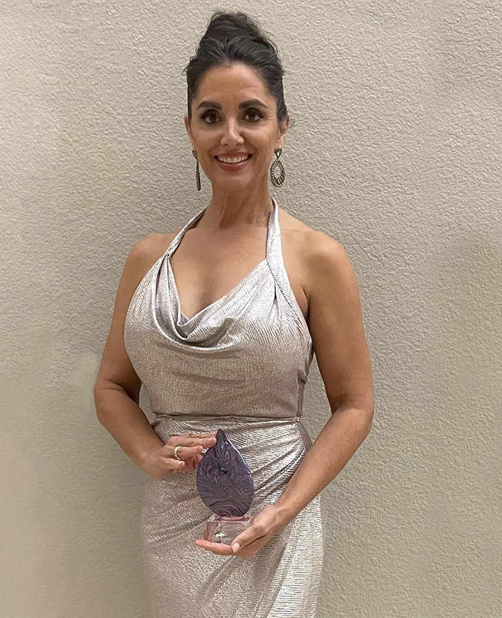 Dr. Teresa Hardesty, OSU Medicine physician and OSU College of Osteopathic Medicine alumnus, holds her 50 Making a Difference award during the Journal Record's Women of the Year Gala.