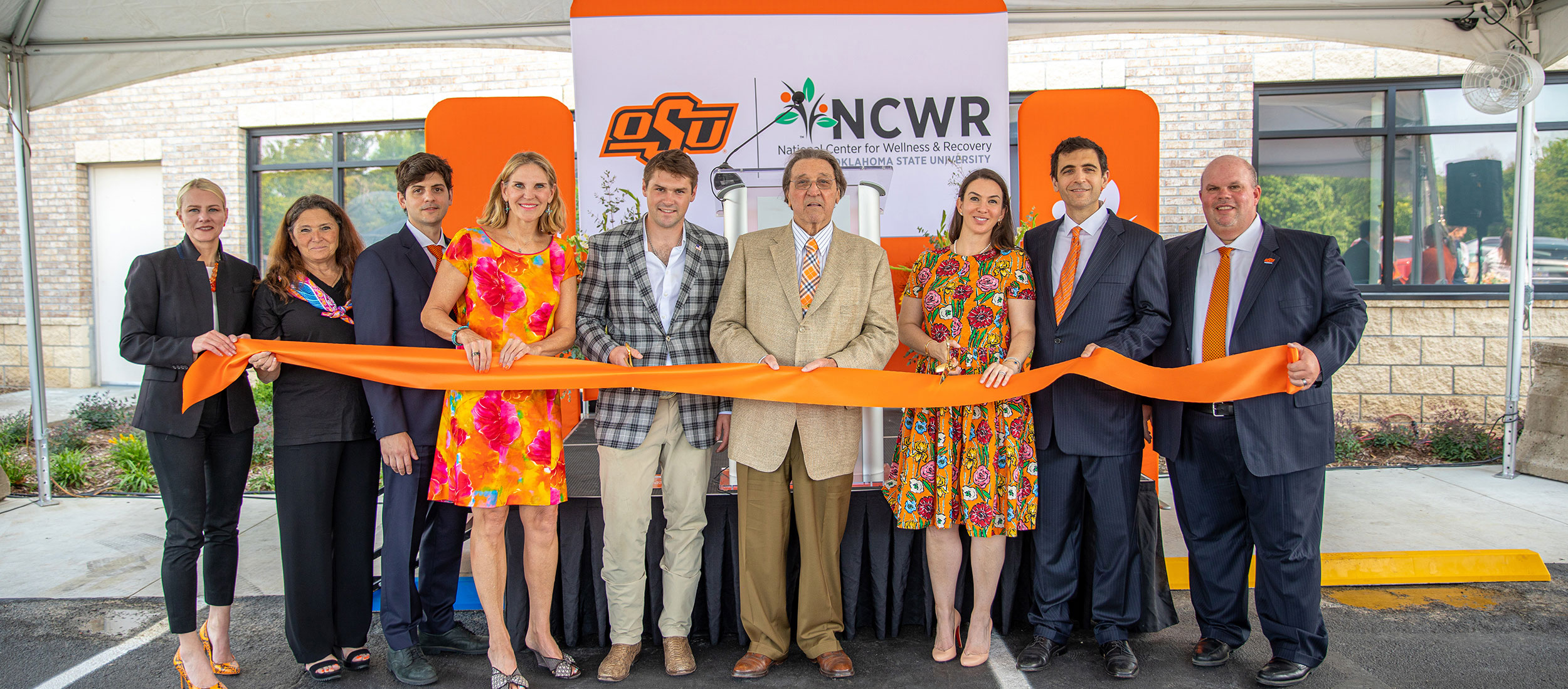 OSU President Kayse Shrum, far left, and Interim OSU Center for Health Sciences President Johnny Stephens, far right, with members of the Hardesty family, from left, Debbie Cristo, Alex Cristo, Michelle Hardesty, Connor Hardesty, Roger Hardesty, Jessie Cristo and Paul Cristo cut the ceremonial ribbon at the opening of the Hardesty Center for Clinical Research and Neuroscience.