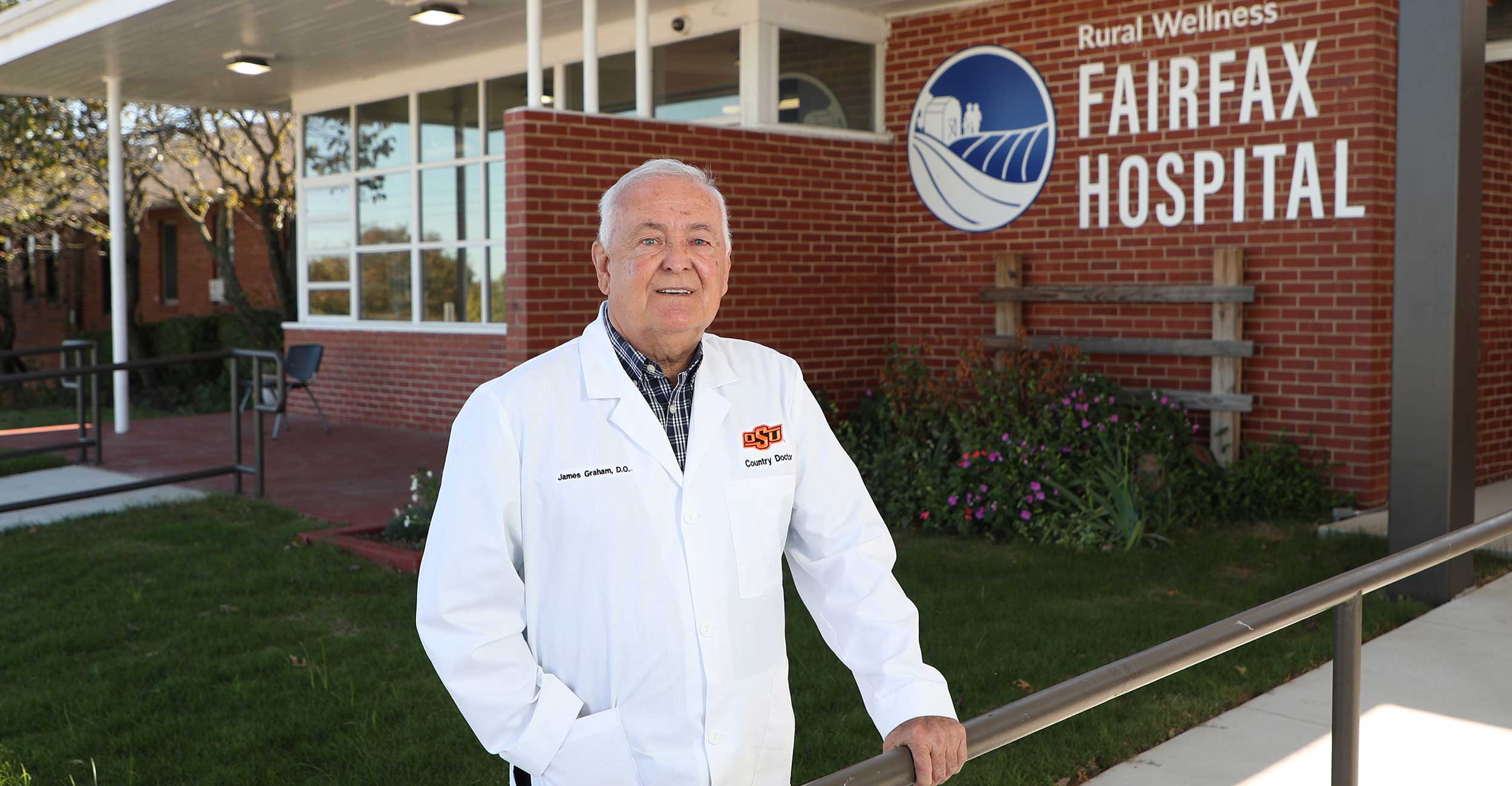 OSU College of Osteopathic Medicine alumnus Dr. James Graham stands outside the Rural Wellness Fairfax Hospital in Fairfax, Oklahoma.