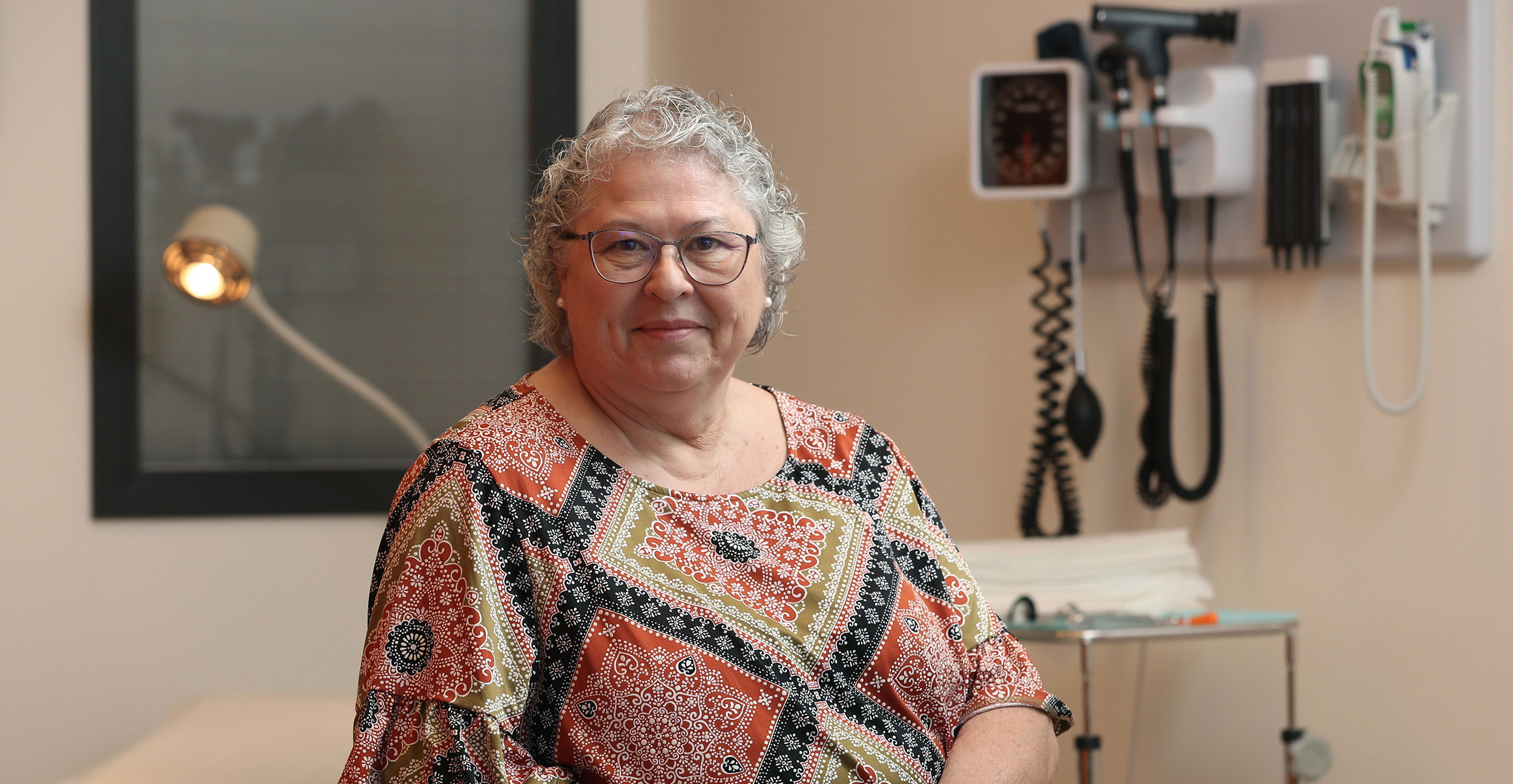 Kathy Bell, an adjunct professor at OSU Center for Health Sciences School of Forensic Sciences, poses iin a simulated patient room on the OSU-CHS campus in Tulsa.