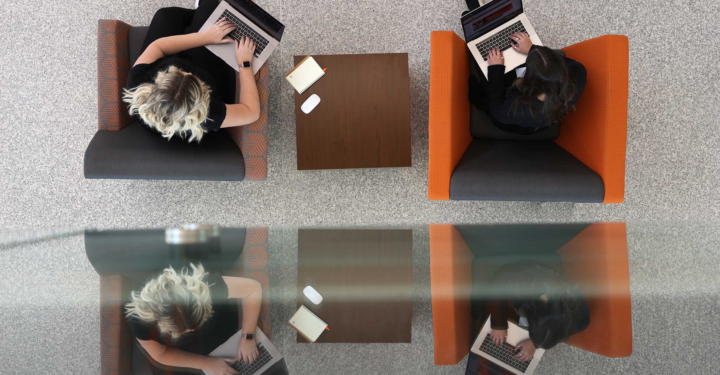 OSU Center for Health Sciences students work on their laptops while on campus.