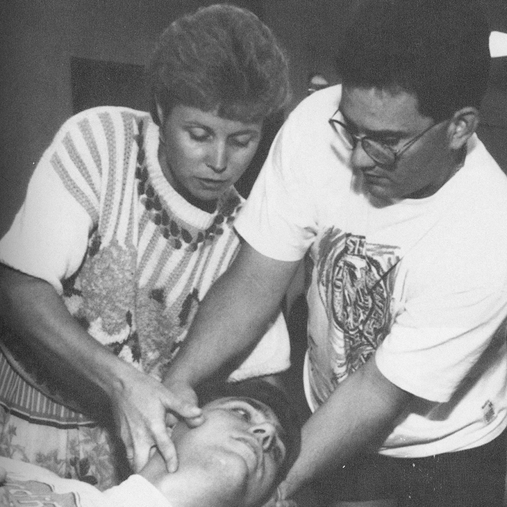 Dr. Robin Dyer, left, instructs a student in osteopathic manipulative medicine at OSU College of Osteopathic Medicine.