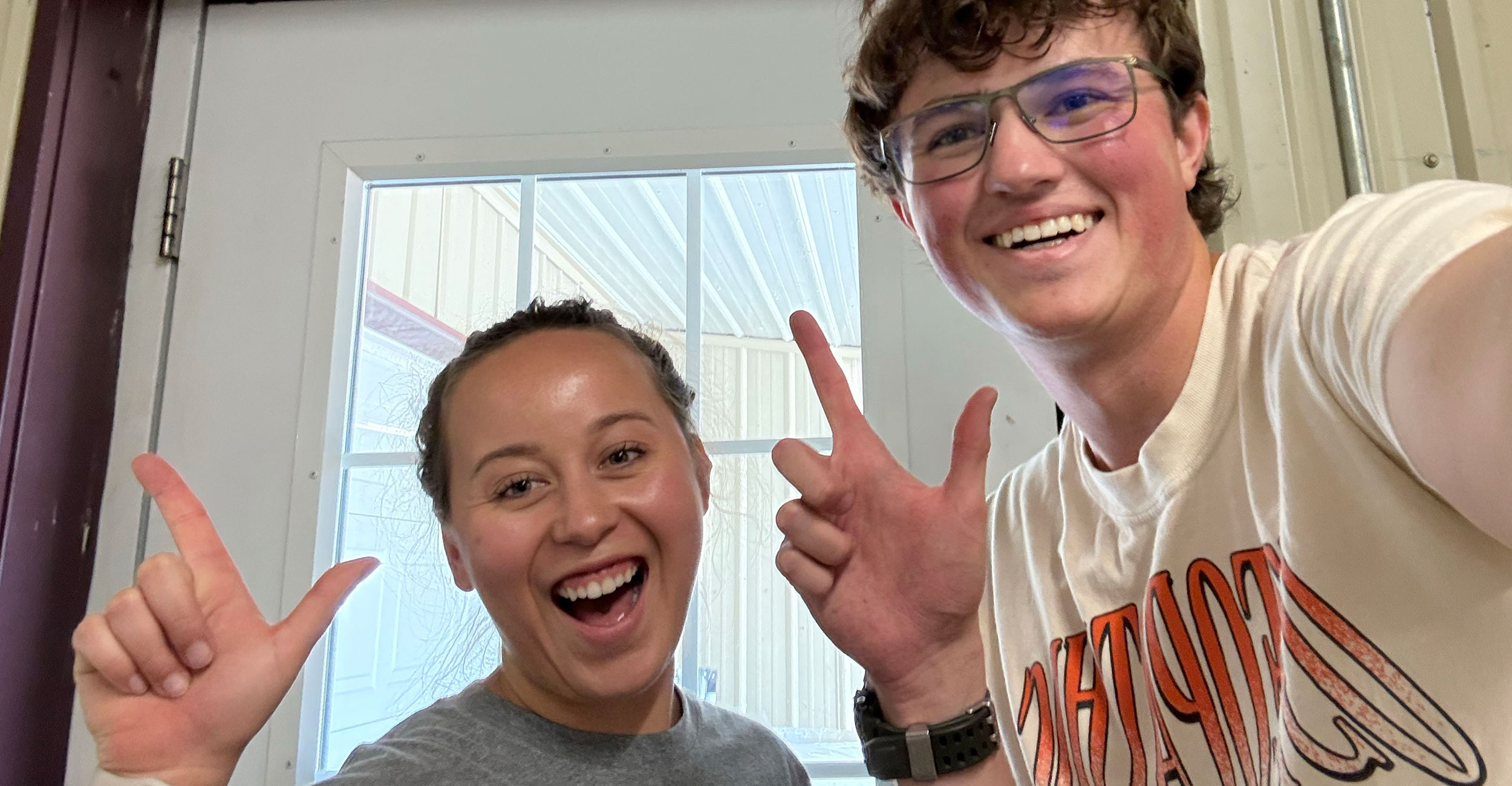Oklahoma State University College of Osteopathic Medicine students Maria Nolan and Jake McAlester at Warner High School.
