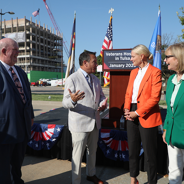 OSU Center for Health Sciences President Johnny Stephens, left, and OSU President Kayse Shrum talk with Tulsa County Commissioners Stan Sallee and Karen Keith during the Veterans Hospital in Tulsa topping off celebration.