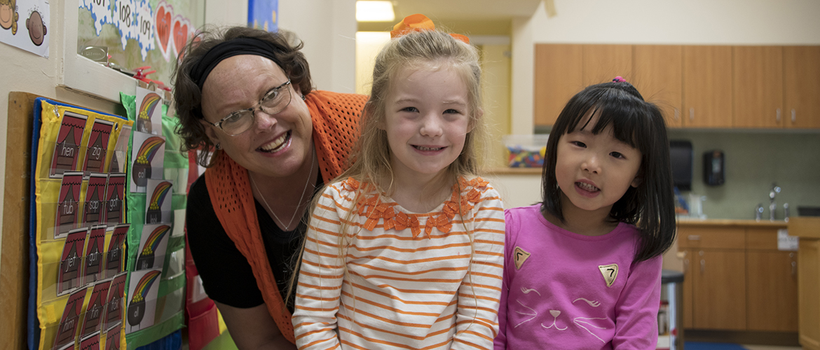 New Child Development Lab Director, Sandy Major, with two CDL students