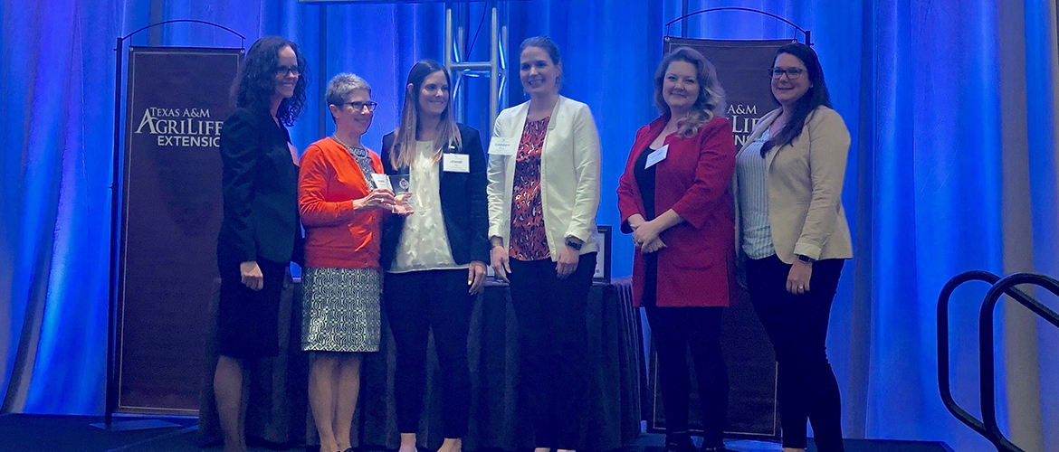 The Oklahoma State University Cooking for Kids program team with the 2019 Priester Award at the National Health Outreach Conference in Fort Worth, Texas