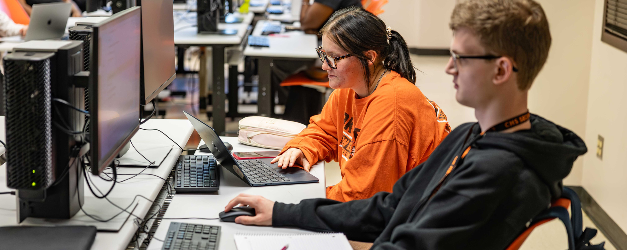 Students work on computers in a lab.