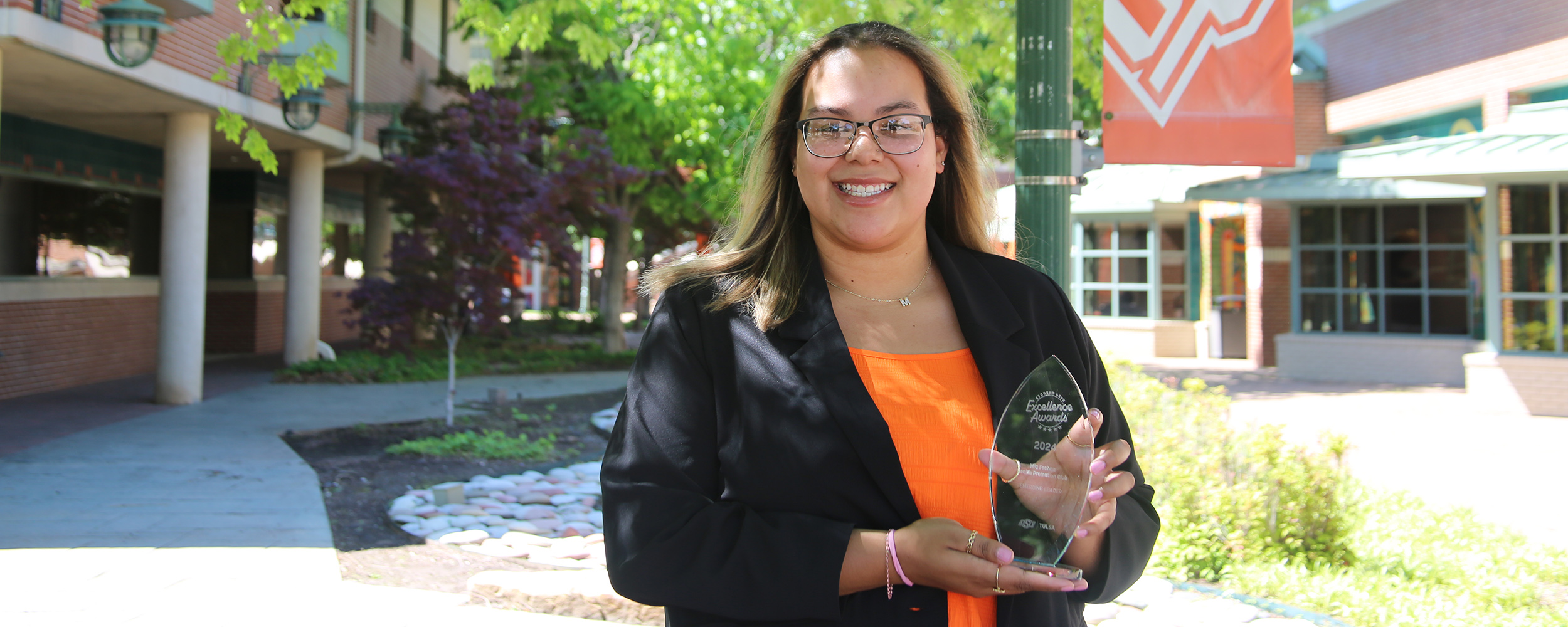 Mia Feehan poses with her Emerging Leader Award.