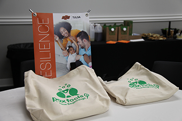 A shot of a canvas bag and sign promoting the PAX Tools program at an event at OSU-Tulsa.