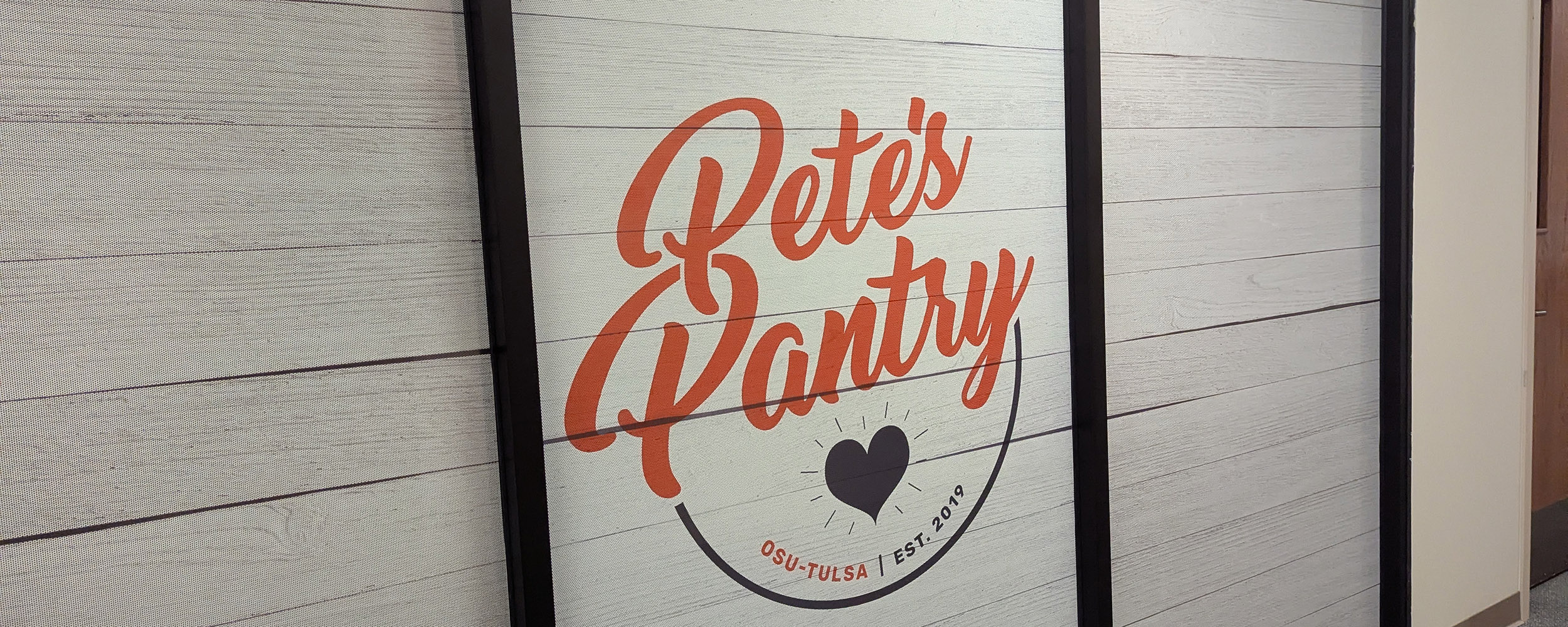 Pete's Pantry logo displayed at the windows of Pete's Pantry in OSU-Tulsa's North Hall Building.