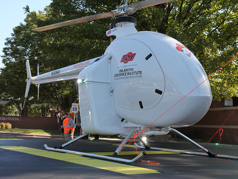 An autonomous helicopter, displayed outside OSU-Tulsa's Main Hall.