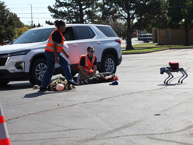 One of OAIRE's robot canines runs medical supplies to emergency operations demonstrators.