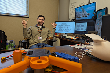Dr. Anthony Comer in his office in OSU-Tulsa's Helmerich Research Center.