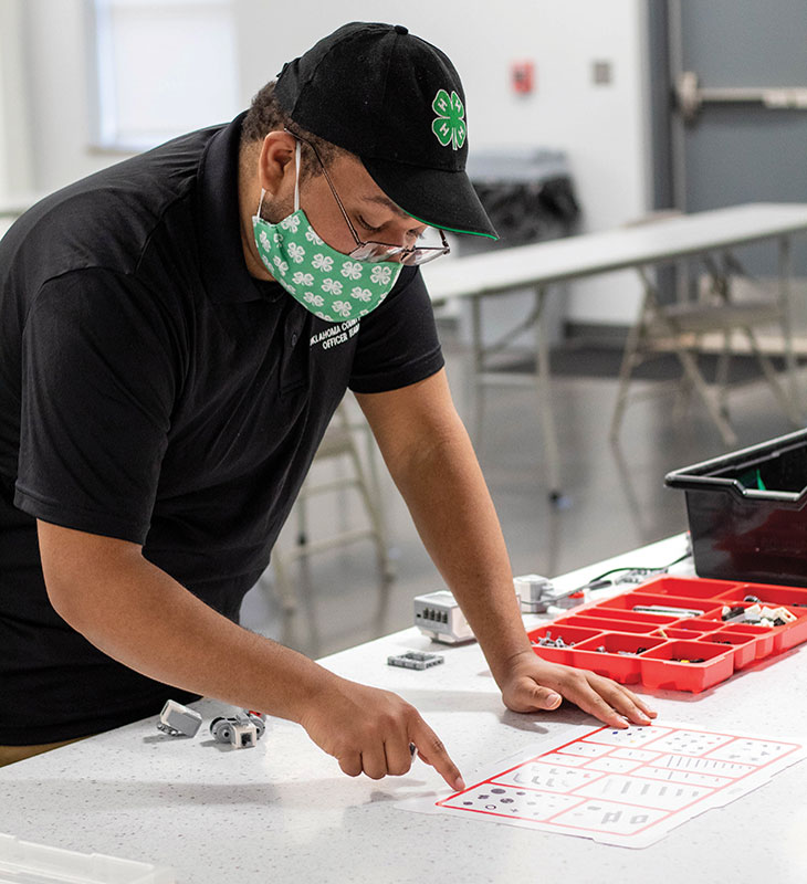 4-H Youth in Action Award winner Aidan Spencer facilitates a robotics workshop for 4-H members