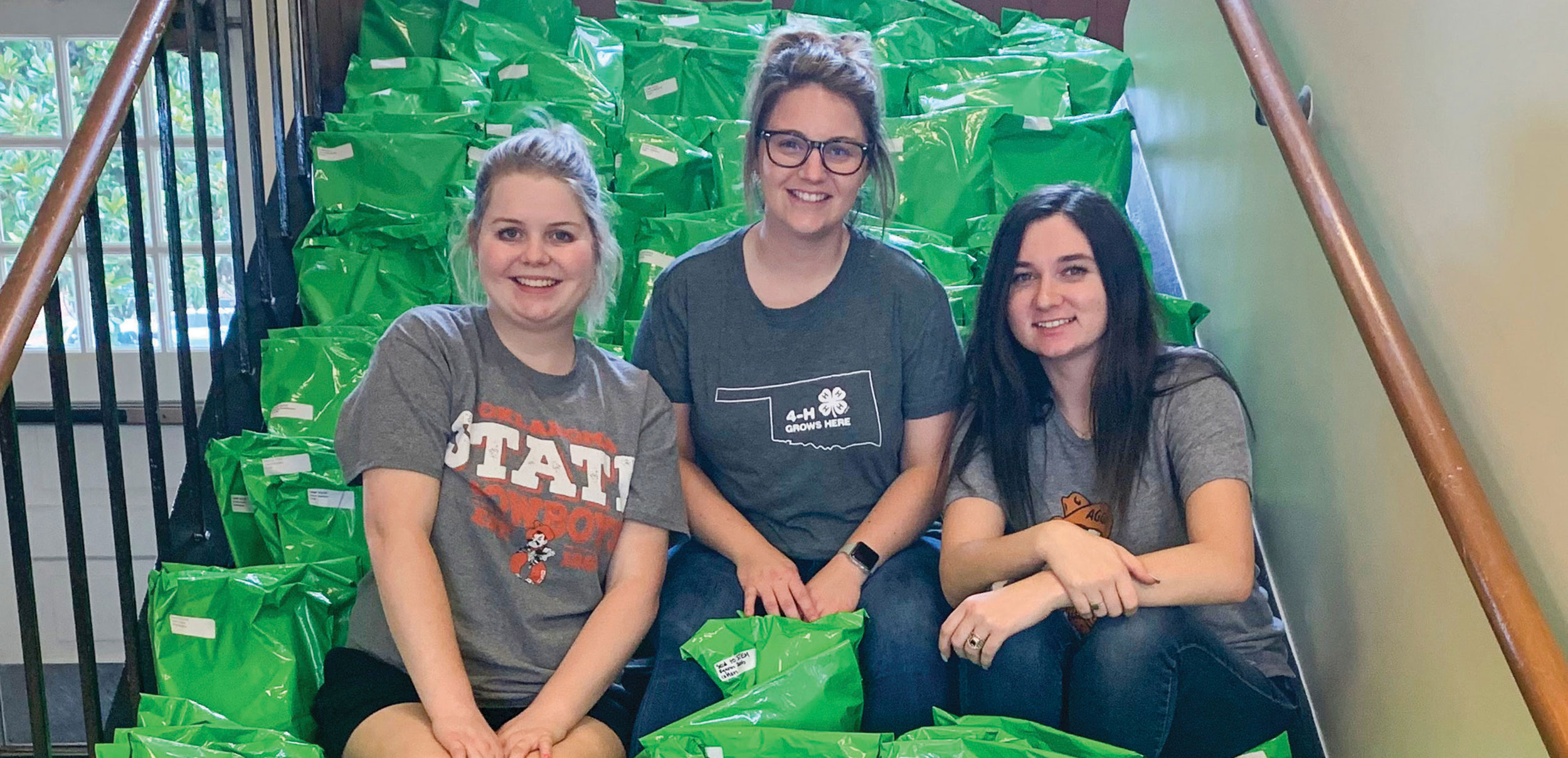 Caitlin Dreher (left), Alex Cox and Kaylee Piatt prepare to ship more than 350 parcels for Oklahoma 4-H members completing the 2021 Camp in a Box program.