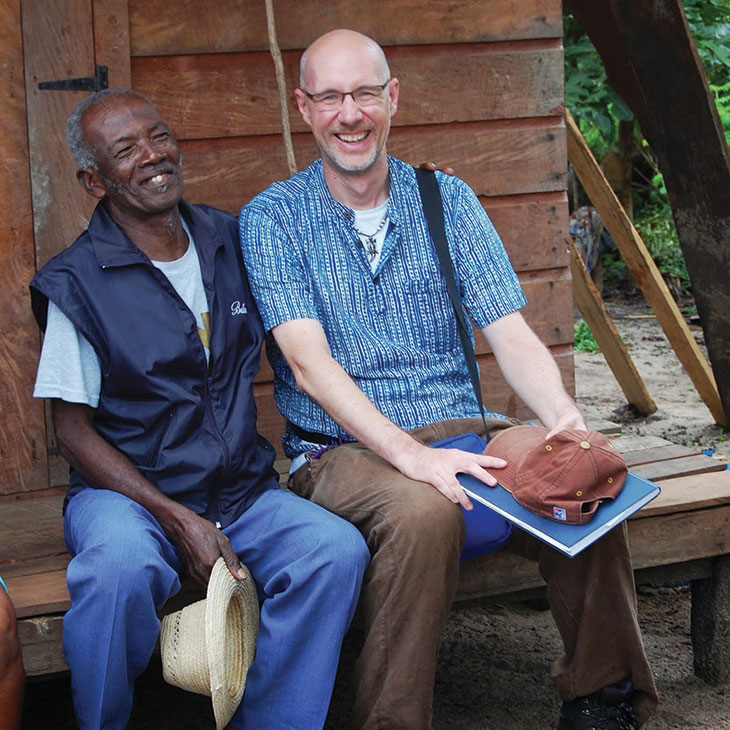 While working on a study in Maroantsetra, Madagascar, Karl Rich, OSU MIAP director, enjoys a moment with a local farmer.