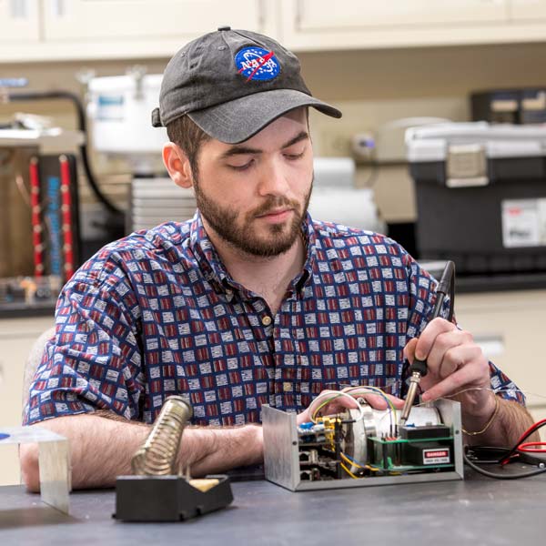 OSU student Tristen Lee works on the radiation detector, or dosimeter, developed at the AIRE Institute at OSU.