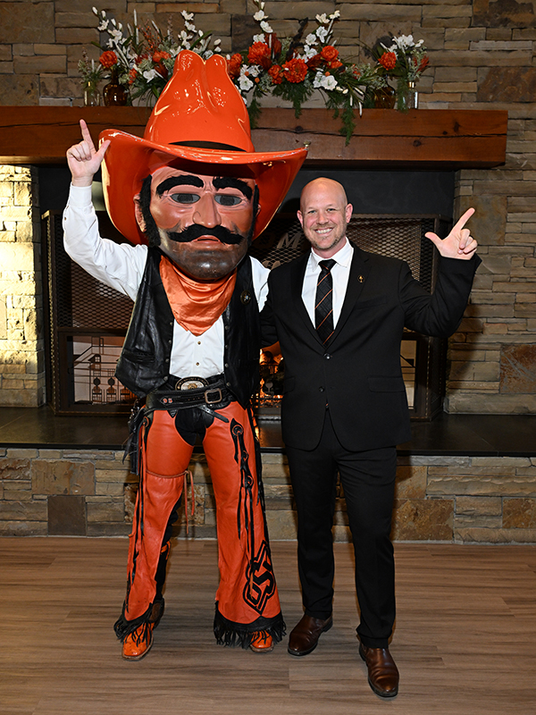 Pistol Pete and Jerrad Ackerman during the MSIS Cloud of Honor ceremony.