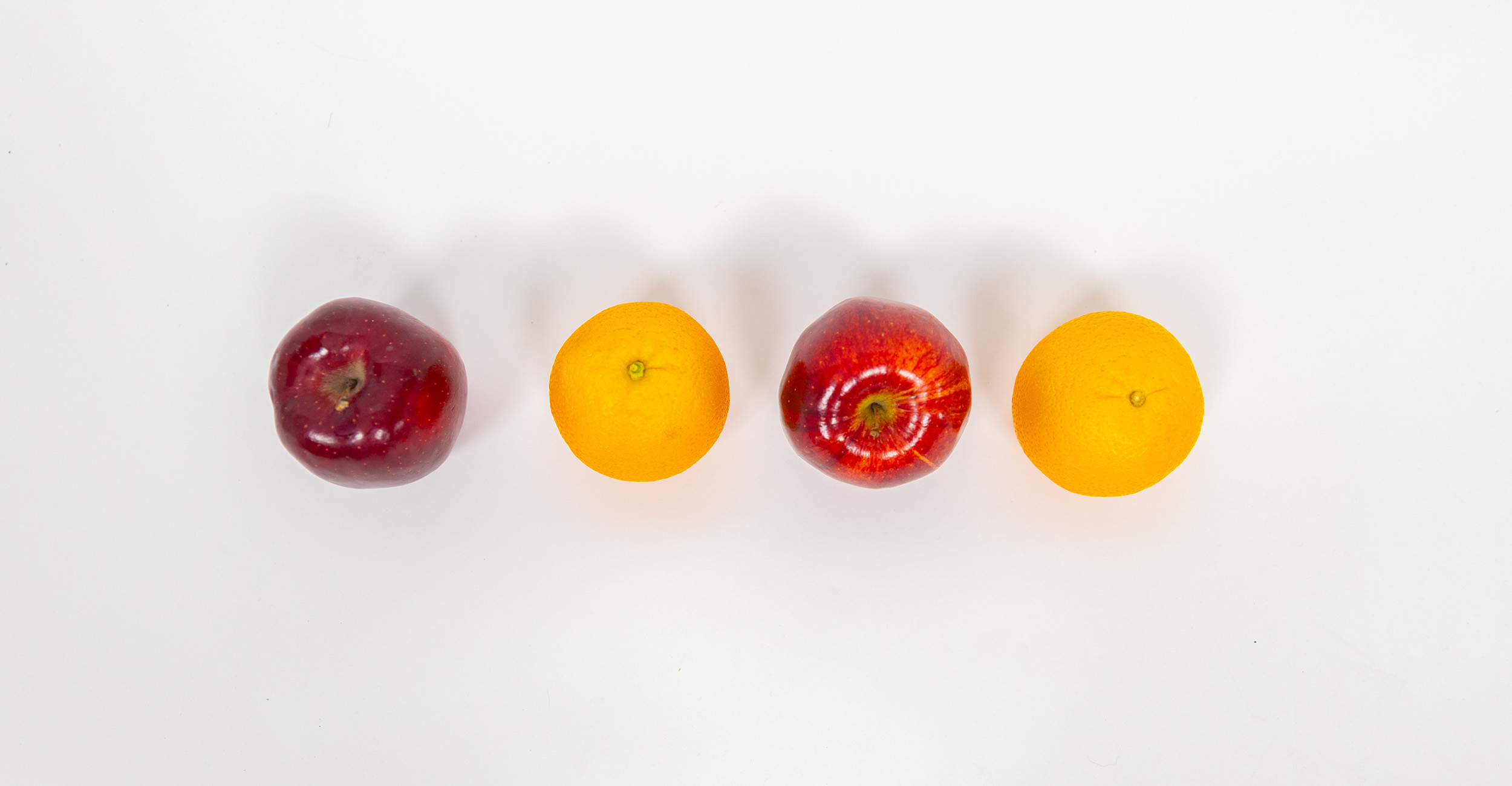 a line of apples and oranges