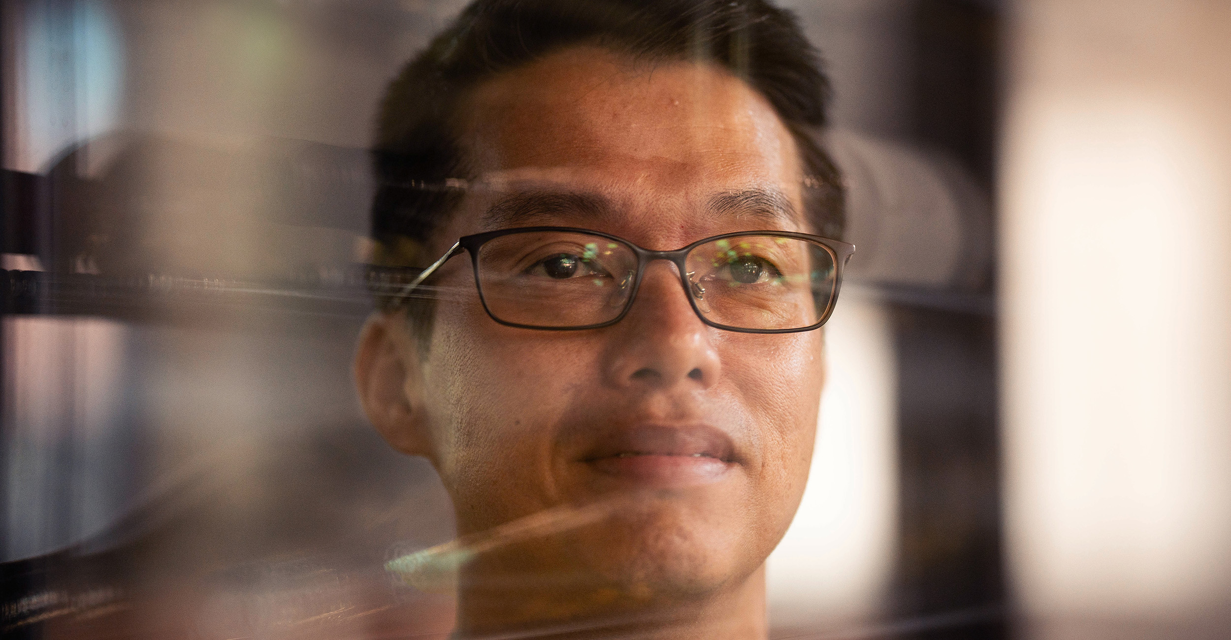 Dr. Kevin So in the wine cellar at the School of Hospitality and Tourism Management.