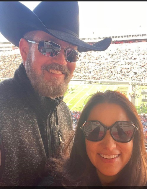 Kimberly Pearson at an OSU football game with her husband. 