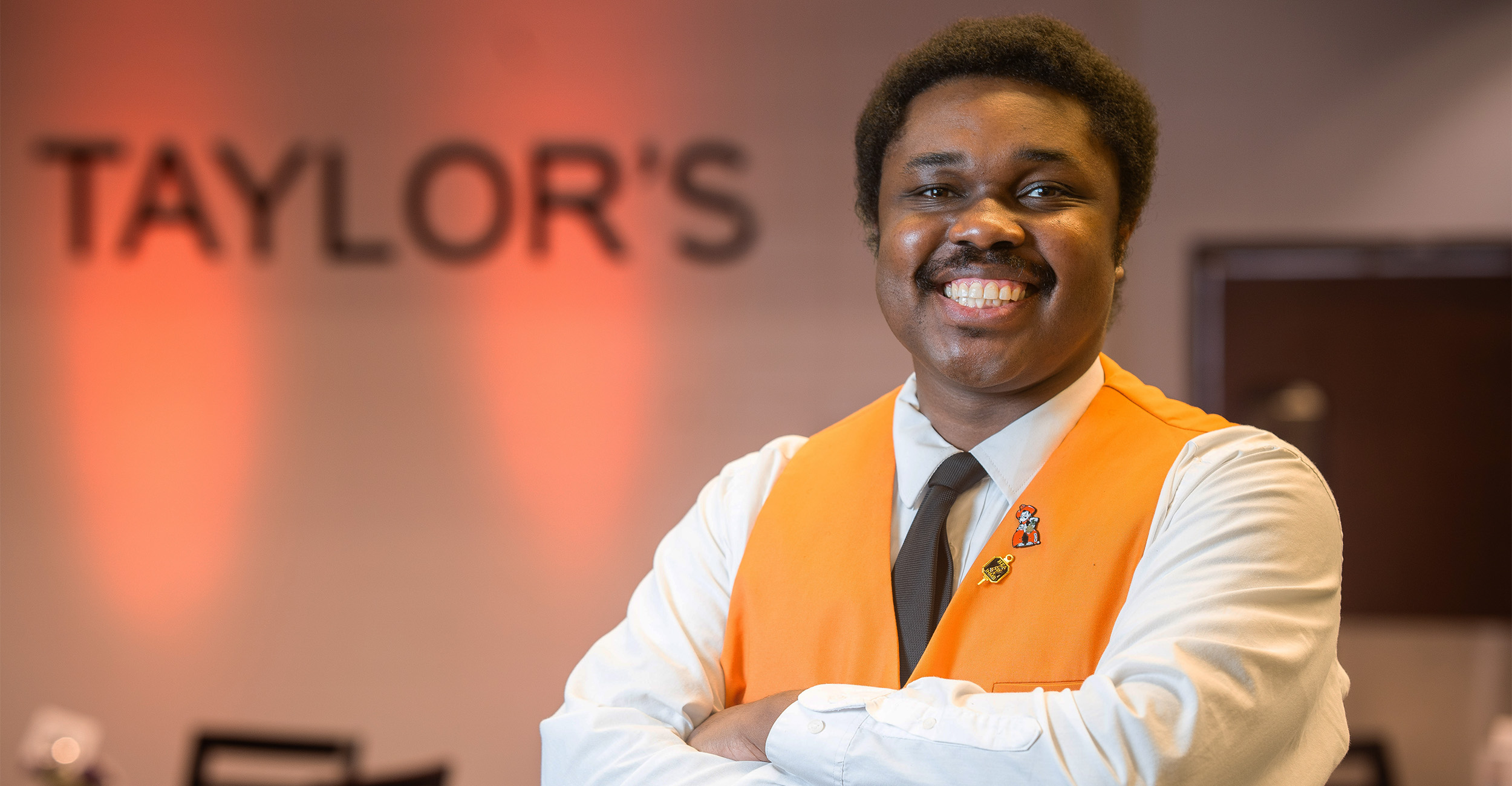 Anthony McHenry smiles for a portrait at Taylor's, which doubles as a restaurant and teaching lab at OSU.