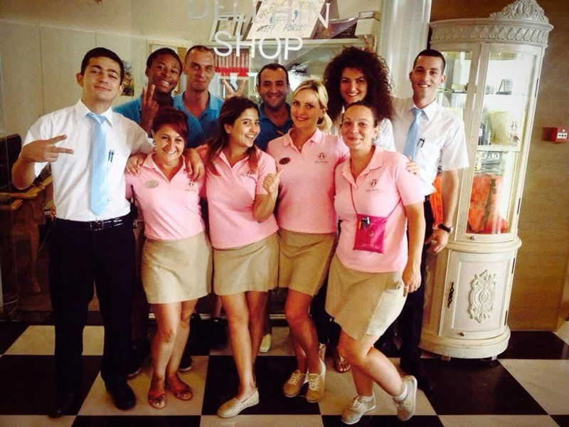 Young interns, including Abraham Terrah, gather for a photo at a luxurious resort in Turkey.