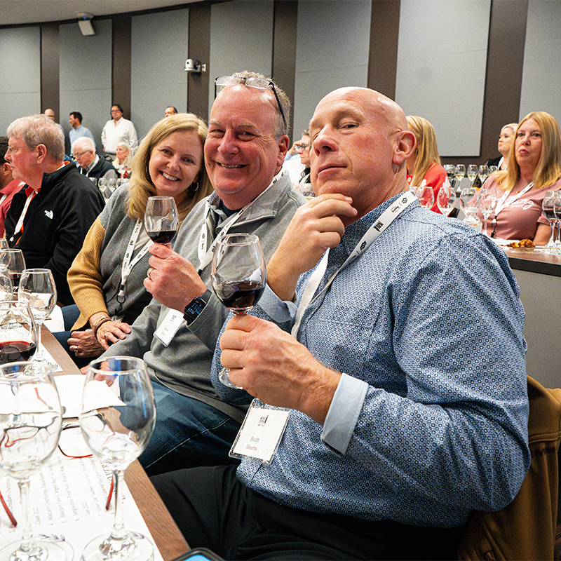 Guests strike a funny pose during a classroom session of the Wine Forum.