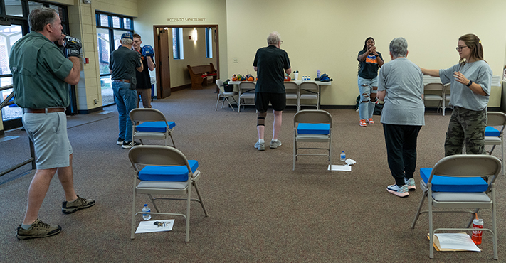 Group of Parkinson's CANe participants engage in OSU student led exercises.