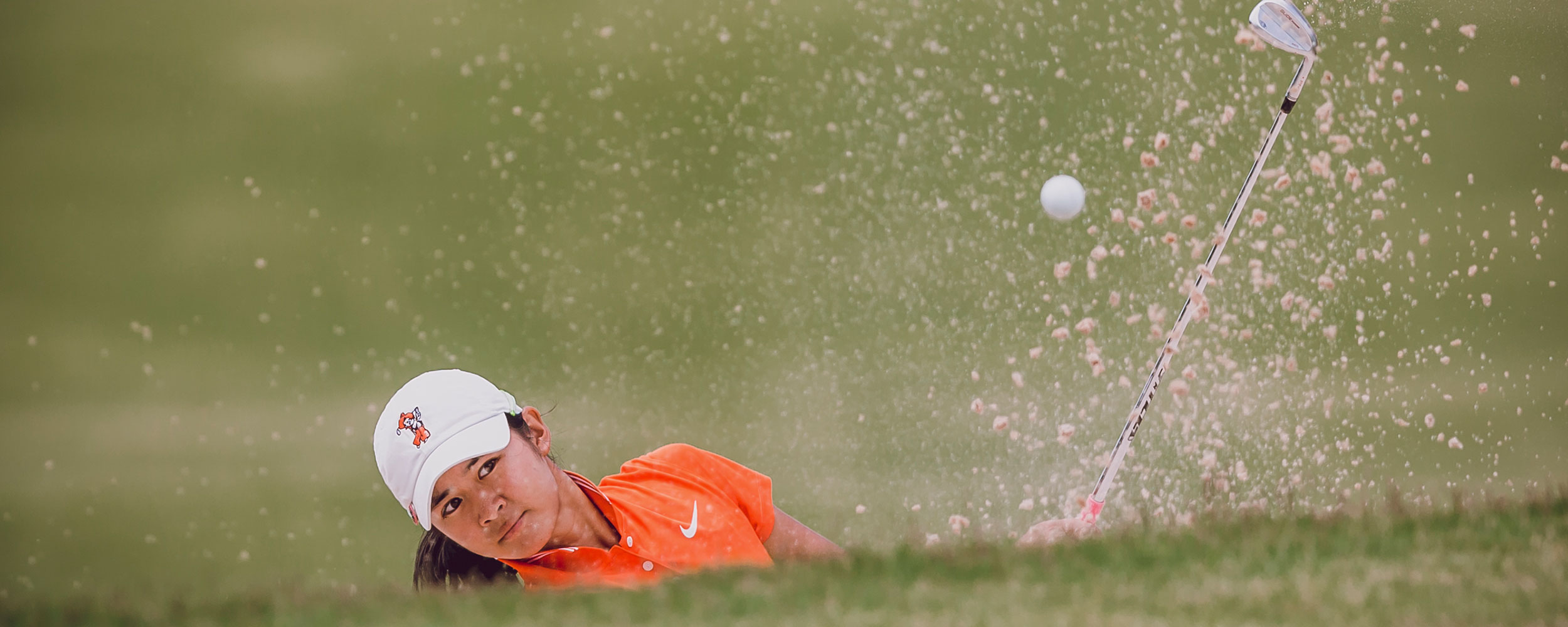 Golfer utilizes strength testing equipment.