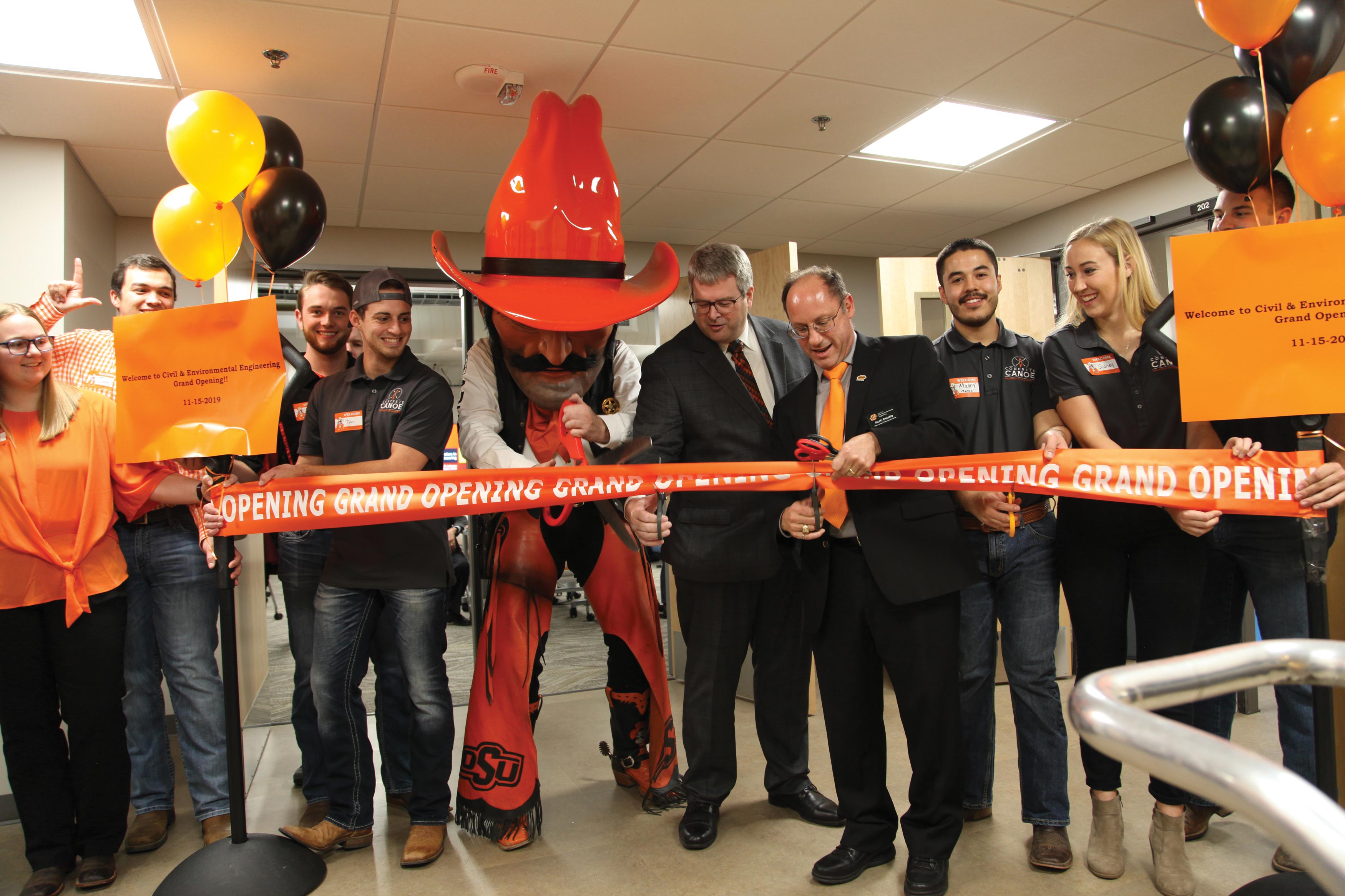 Dean Paul Tikalsky, Dr. Norb Delatte (department head for CIVE) and Pistol Pete, along with CIVE students attend the ribbon cutting ceremony for Civil and Environmental Engineering’s new home on the second floor of Engineering North.